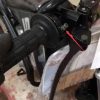 Apollo DB-21 Kids Dirt Bike with Training Wheels - controls detail view